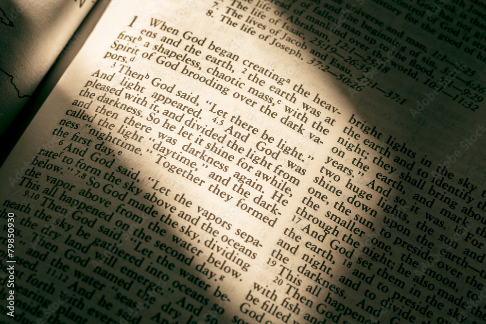 Holy Bible with light casting on Genesis Holy Bible with light casting on Genesis