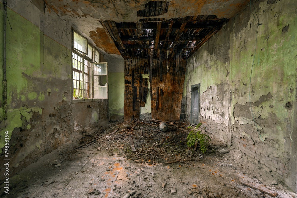 Dark room interior with damaged roof