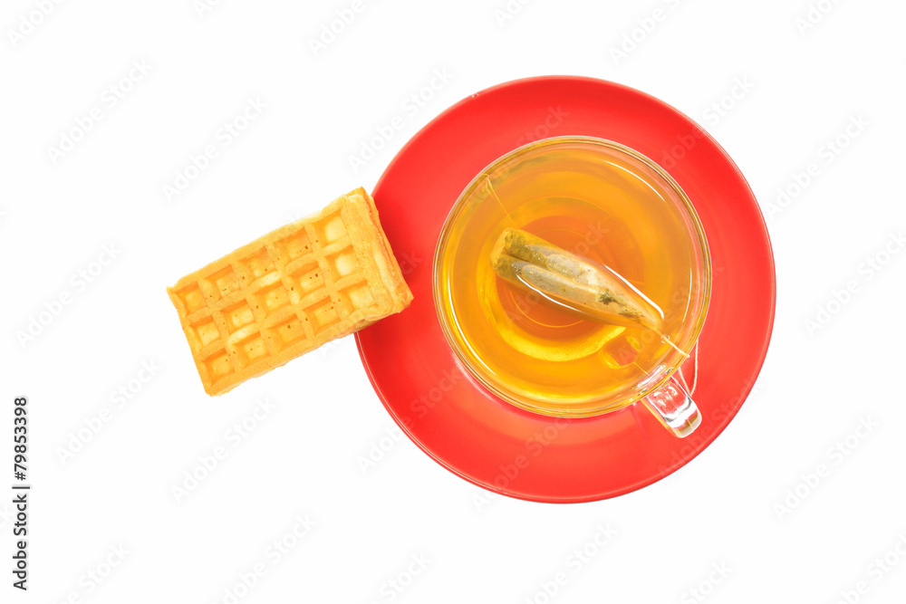 Tea and waffles on red plate