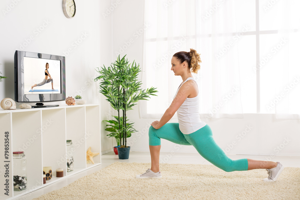 Fototapeta premium Young Woman Doing Stretching Exercises