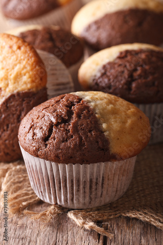 chocolate orange muffin on the table close-up, vertical