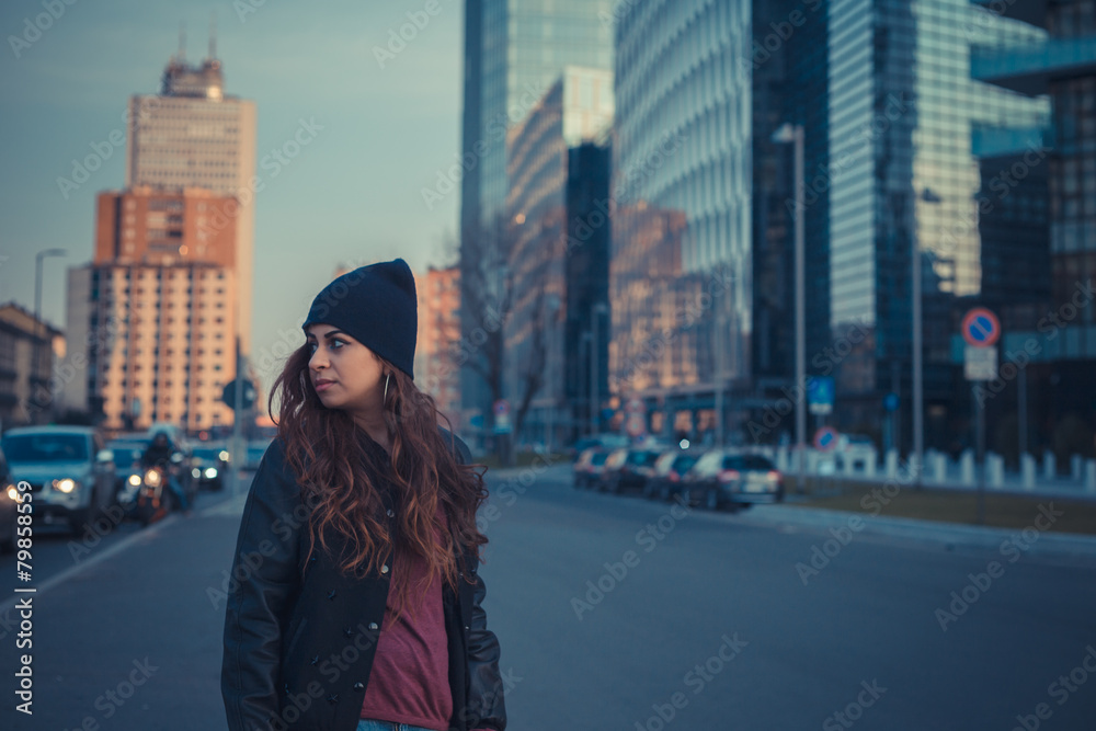 Beautiful girl posing in an urban context