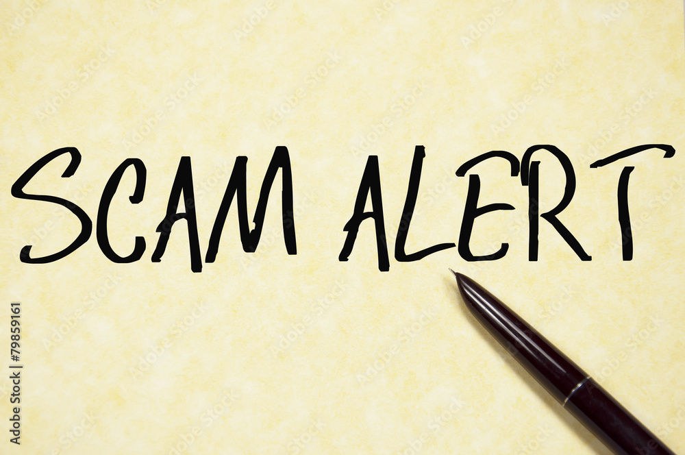 scam alert text write on paper scam alert text write on paper