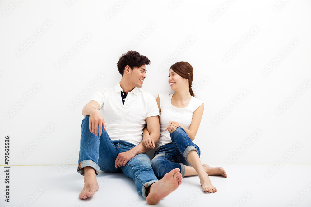Happy Young asian Couple Sitting On Floor Happy Young asian Couple Sitting On Floor