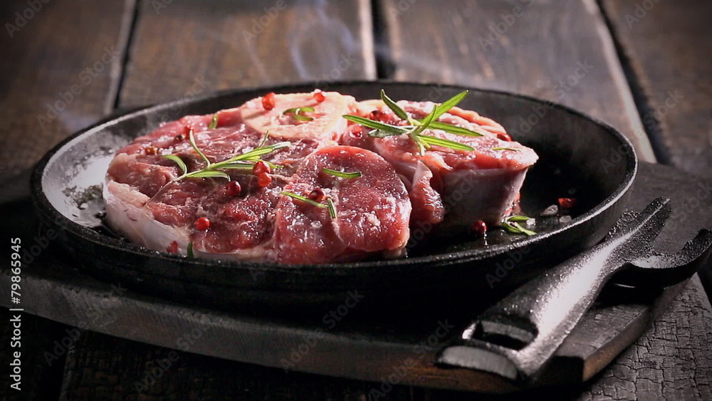 Grilling fresh piece of red meat with herbs Grilling fresh piece of red meat with herbs