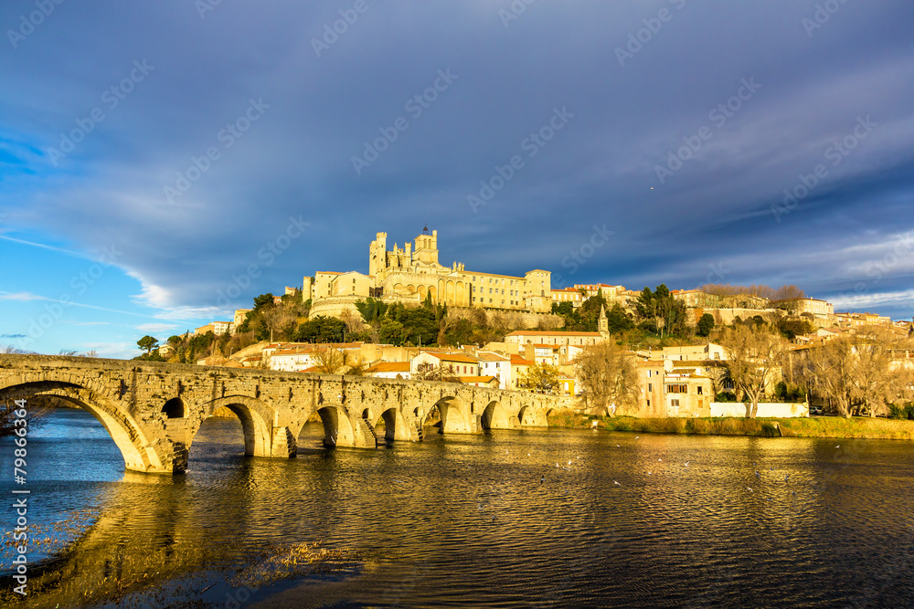 View of St. Nazaire Cathedral and Pont Vieux in Beziers, France View of St. Nazaire Cathedral and Pont Vieux in Beziers, France