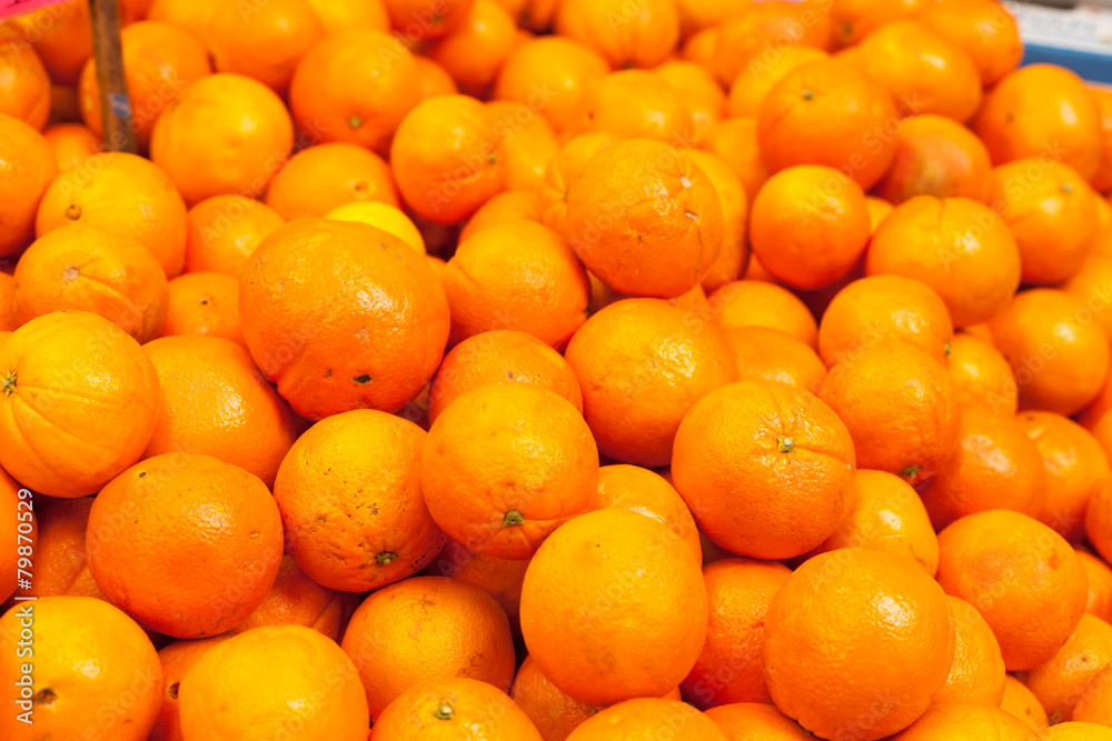 Fototapeta premium Full frame shot of orange fruit in market stall, La Boqueria