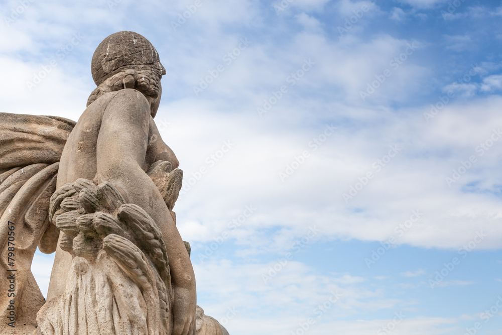 Low angle view of a statue against cloudy sky, Barcelona