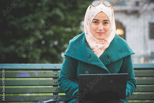 young beautiful muslim woman at the park
