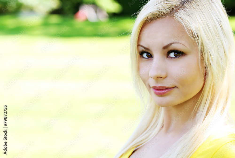 Portrait of beautiful blonde young woman. Outdoor Portrait of beautiful blonde young woman. Outdoor