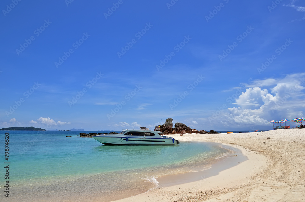 Beach with speedboat