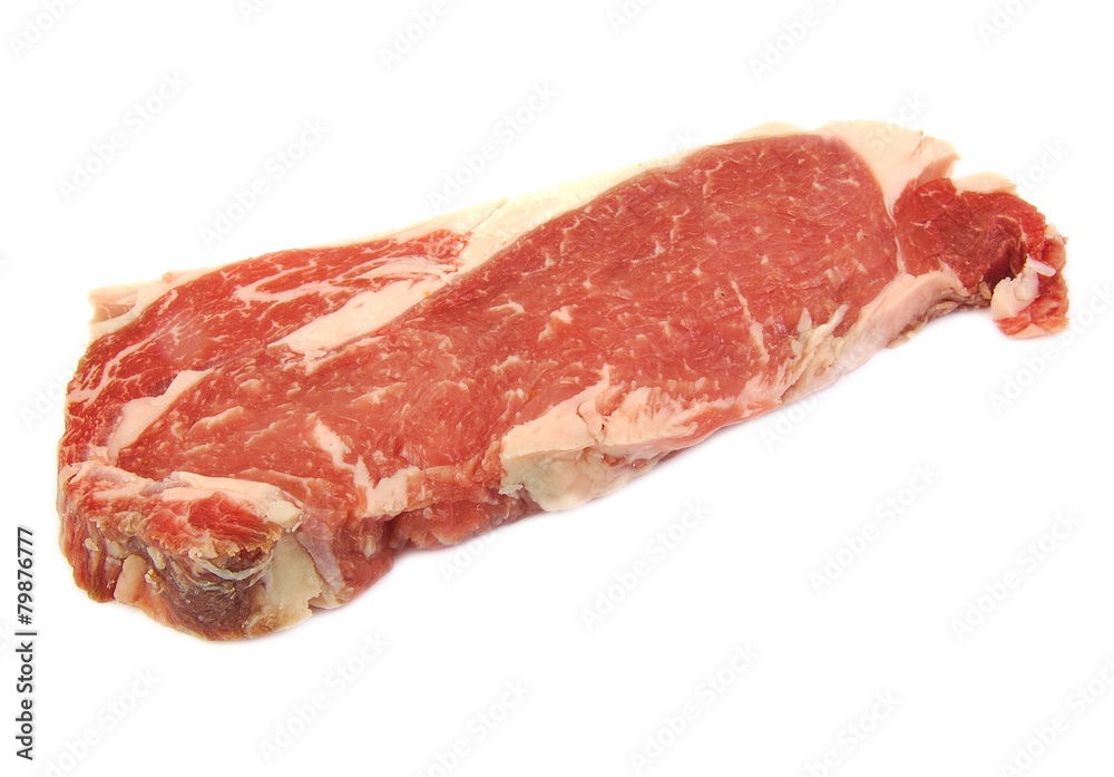 Single uncooked raw entrecote steak on a white background Single uncooked raw entrecote steak on a white background