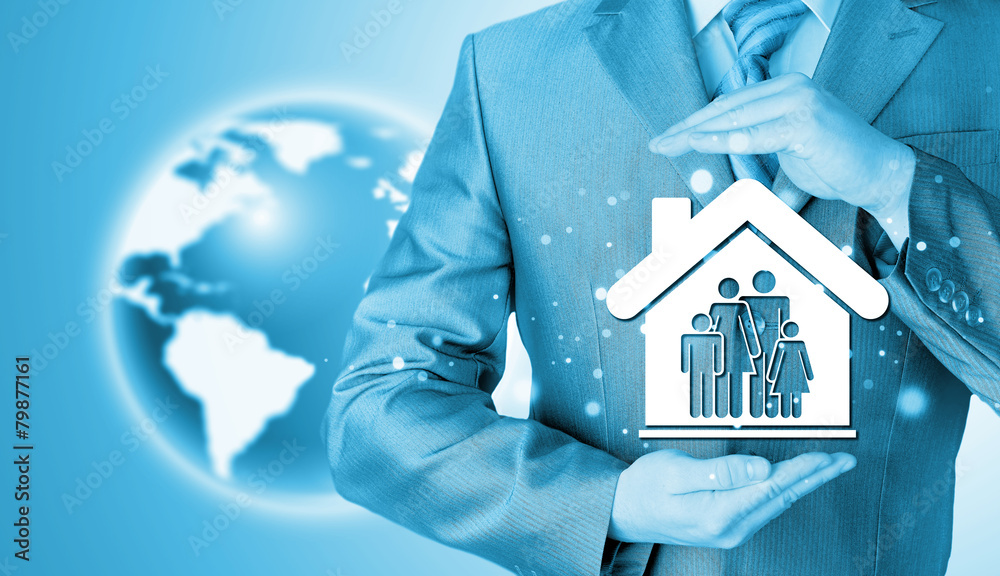 businessman protecting family in home with hands businessman protecting family in home with hands