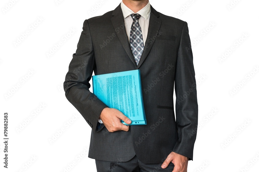 Man in suit holding documents