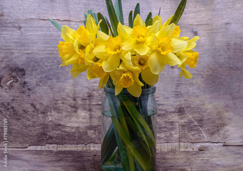 Fototapeta Naklejka Na Ścianę i Meble -  bouquet of daffodils in the glass jar