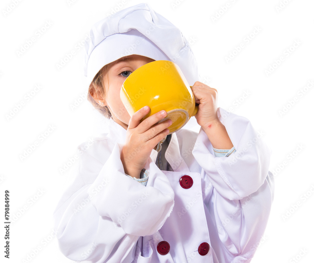 Girl dressed like chef holding a cup of coffee Girl dressed like chef holding a cup of coffee