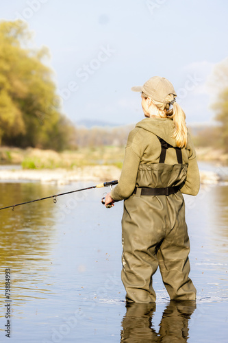 woman fishing in the river