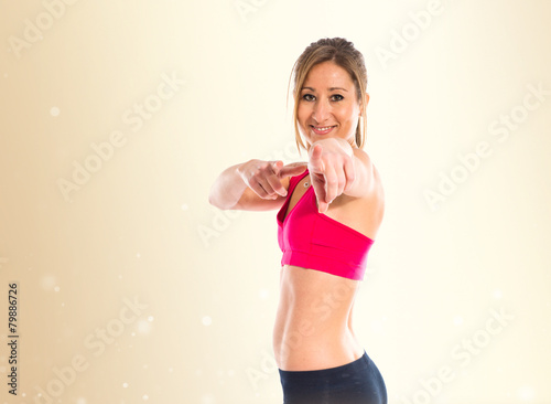 Sport woman pointing front
