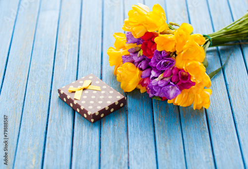 Gift box and bouquet of flowers photo