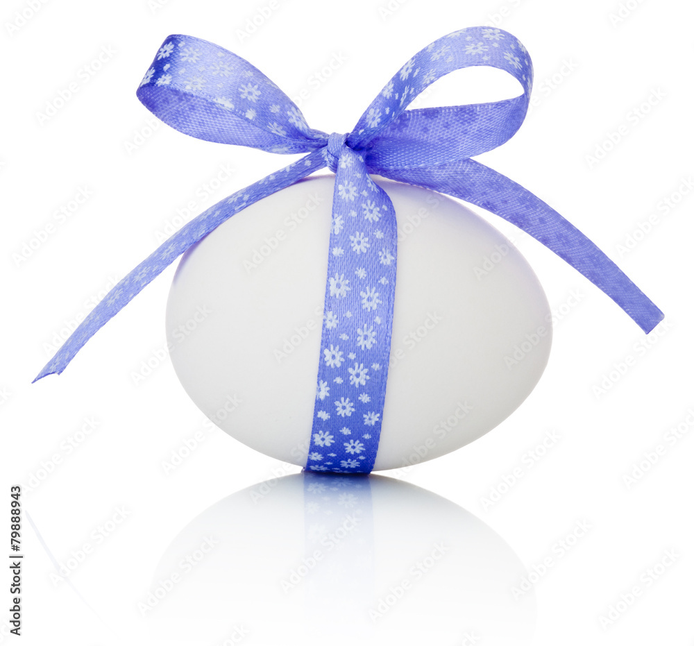 Easter egg with festive purple bow isolated on white background Easter egg with festive purple bow isolated on white background