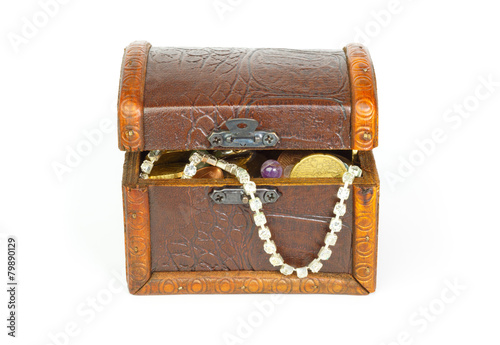 Slightly opened treasure chest with bracelet, coins and pearls