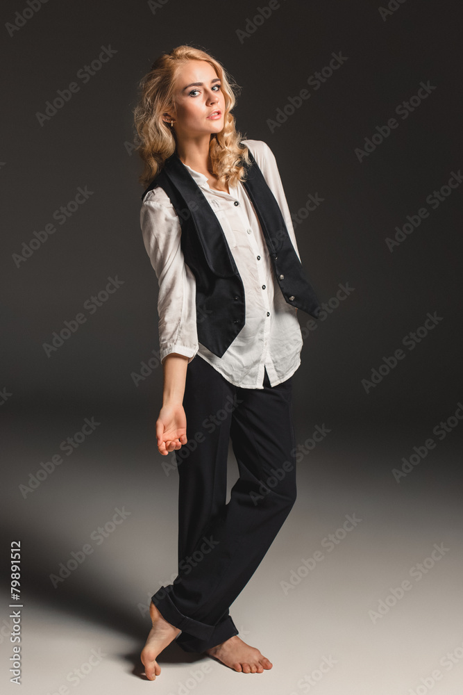 Beauty blond woman on a gray background Beauty blond woman on a gray background