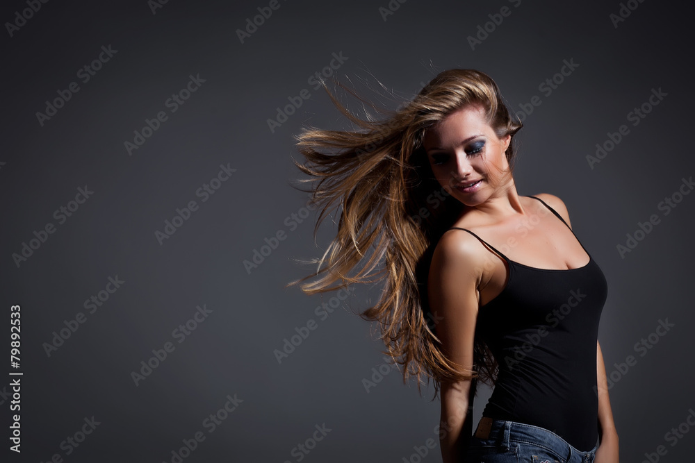 Naklejka premium Happy woman are jumping, grey background