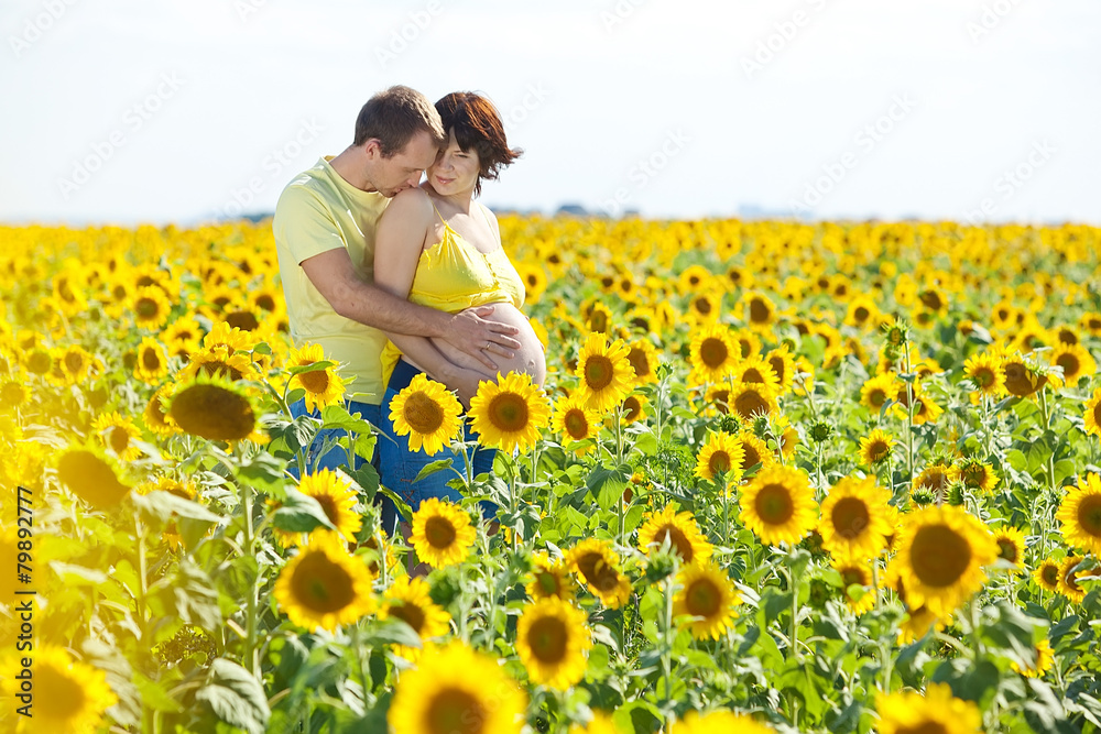 Husband with pregnant wife is resting in nature. Husband with pregnant wife is resting in nature.