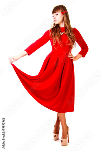 Young woman in a bright red evening dress