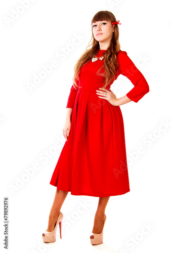 Young woman in a bright red evening dress