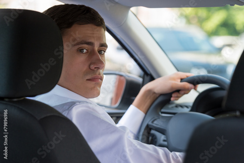 Young man driving car © Milles Studio