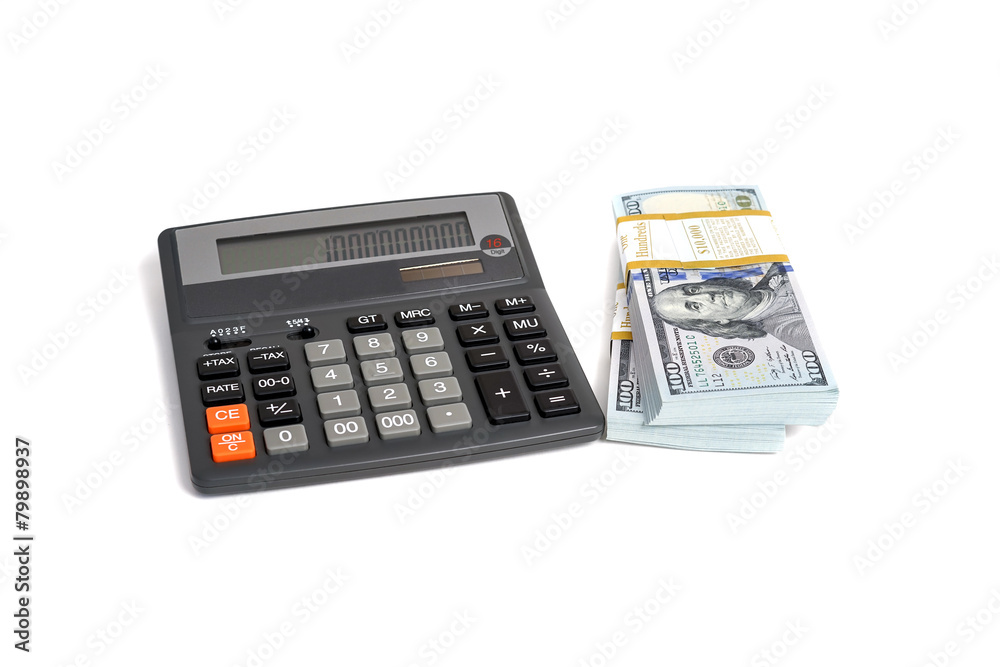 Dollar stack and calculator isolated on a white background Dollar stack and calculator isolated on a white background