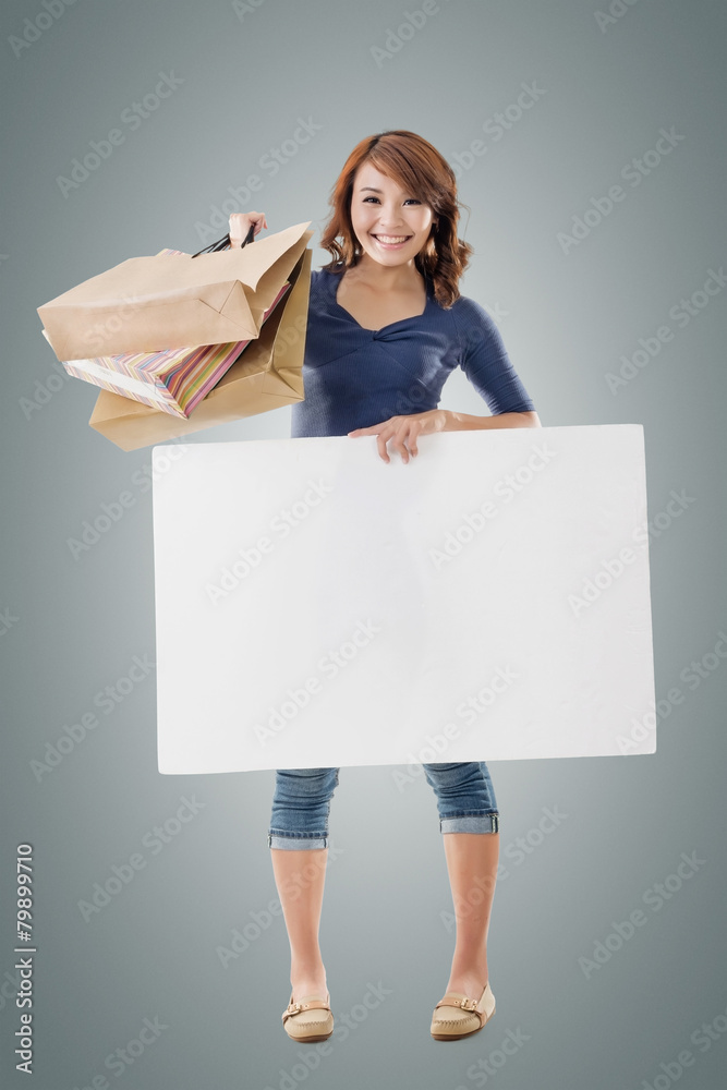 Shopping woman holding bags and blank board Shopping woman holding bags and blank board