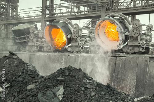Hot steel pouring in steel plant photo
