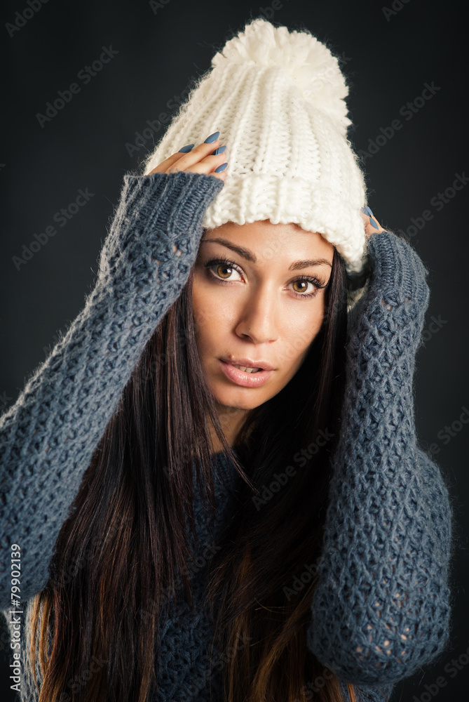 Beautiful young woman portrait wearing wool hat and jumper again Beautiful young woman portrait wearing wool hat and jumper again