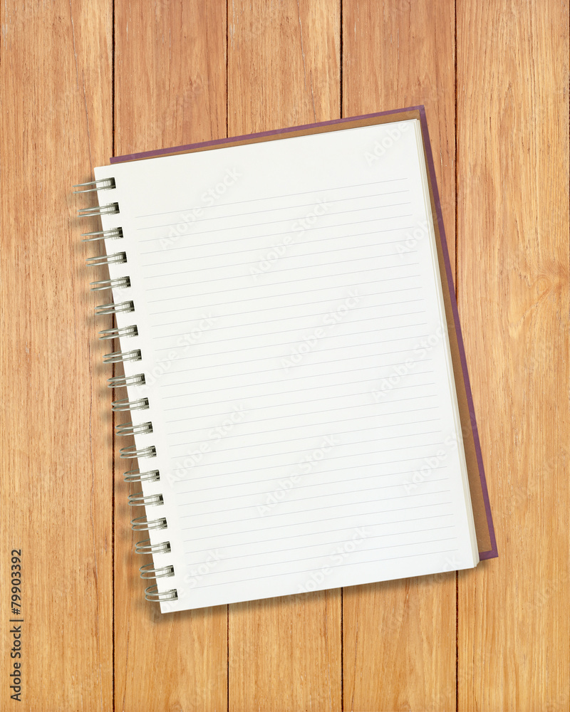 Notebook isolated on wooden background Notebook isolated on wooden background