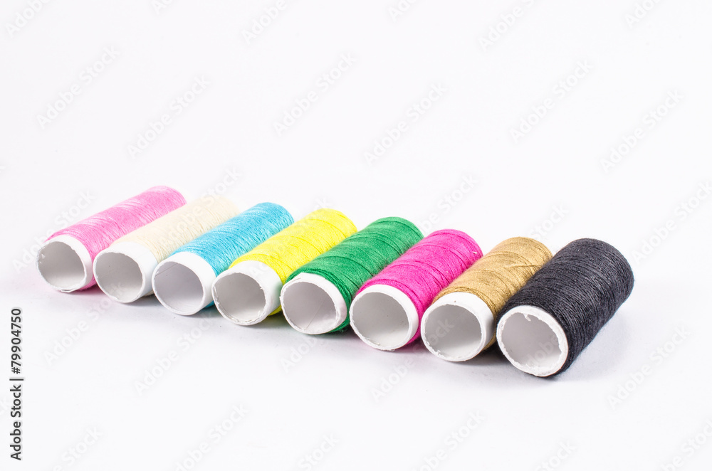 multicolor sewing threads on white background, multicolor sewing threads on white background,