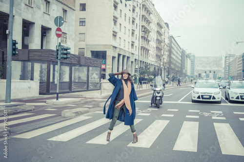 Beautiful young brunette posing in the city streets © tinx
