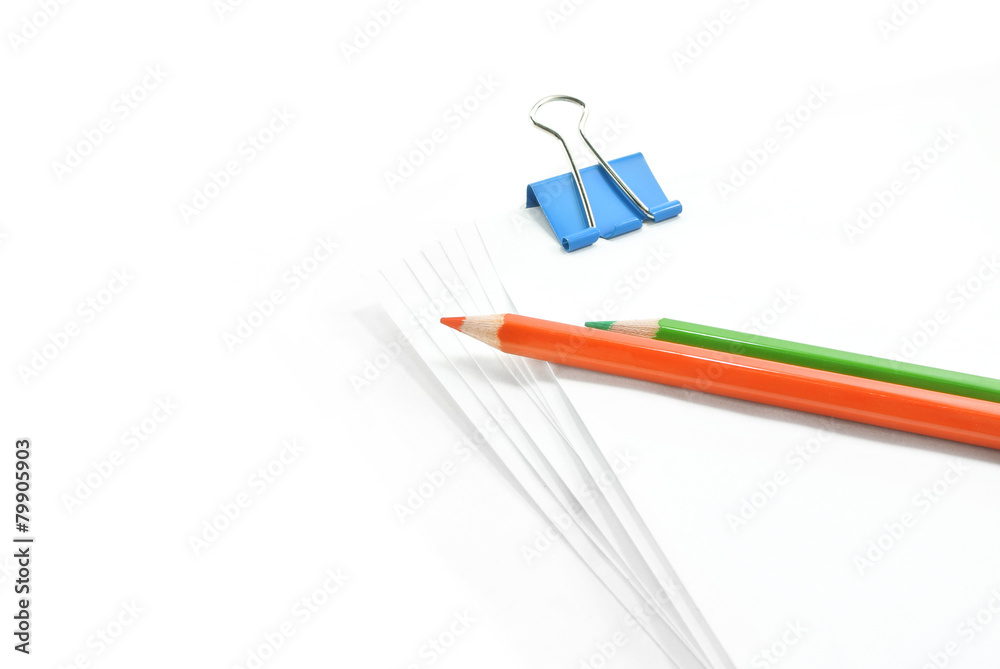 white office paper with clip and color pencil white office paper with clip and color pencil