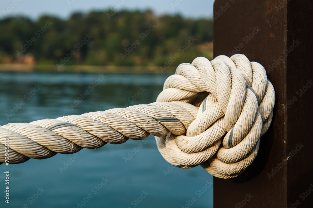Fototapeta premium White rope tied into a knot.