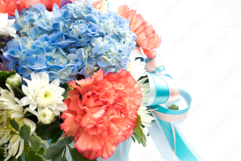 Bouquet with different kind of flowers in basket isolated on whi Bouquet with different kind of flowers in basket isolated on whi