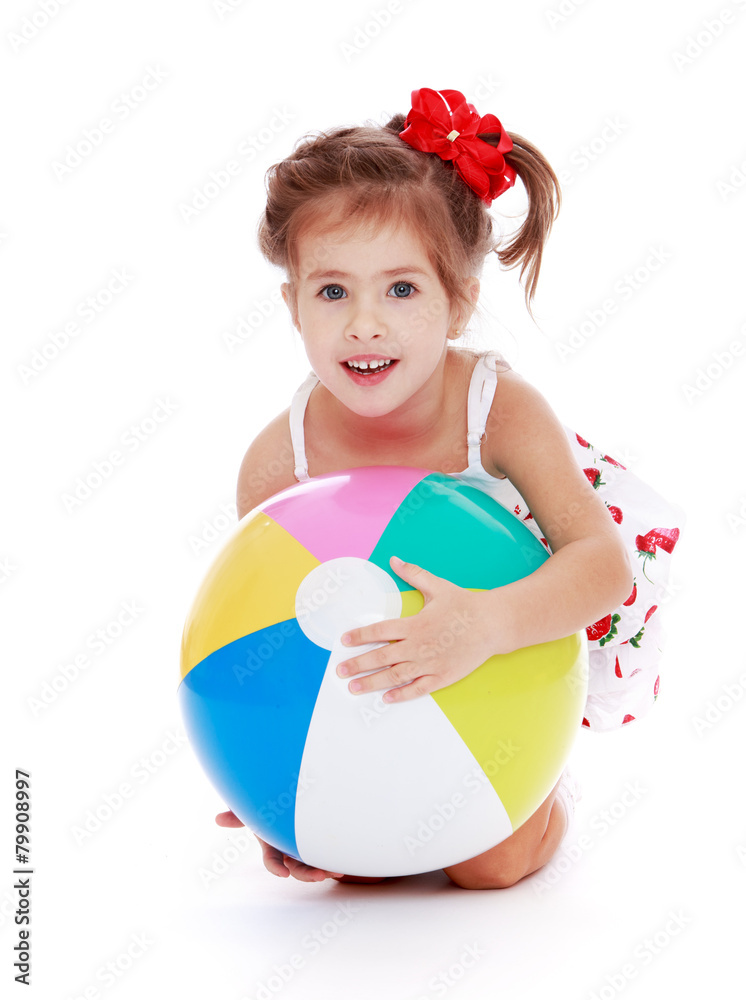 Caucasian beautiful little girl holding a ball Caucasian beautiful little girl holding a ball