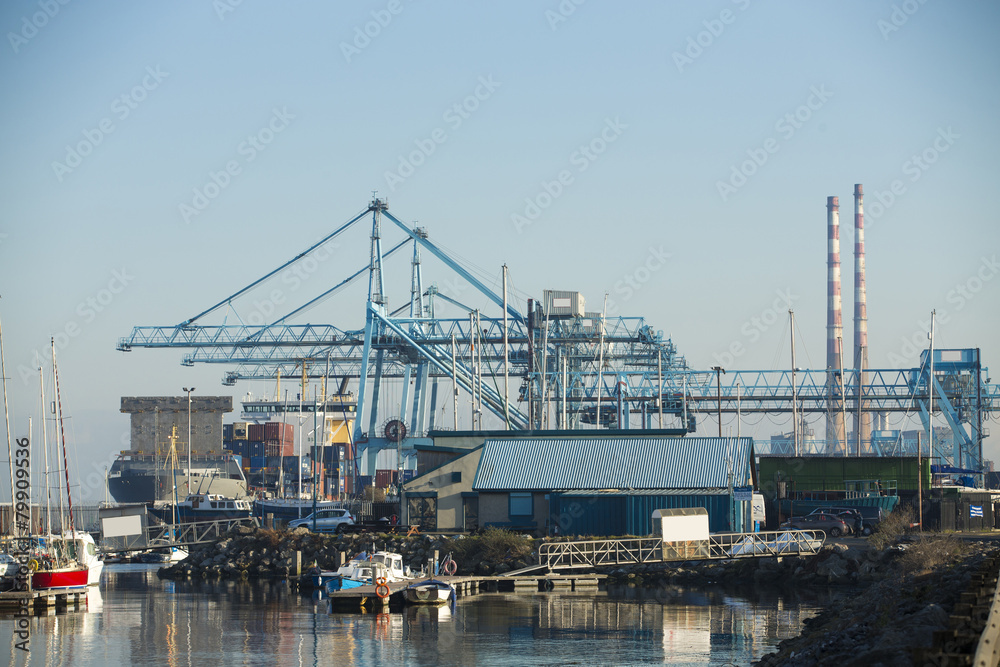 Commercial harbor with large industrial cranes