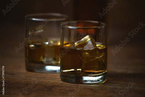 shot of whiskey on old wooden surface