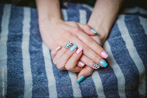 Girl shows blue manicure