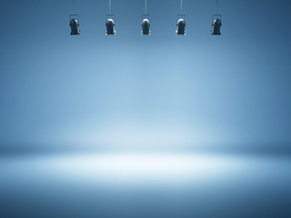 blue spotlight background with studio lamps