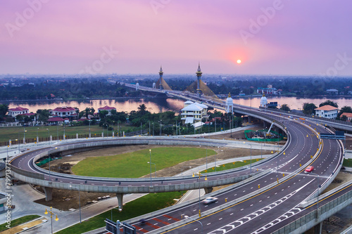 cable bridge and road street with sunset photo