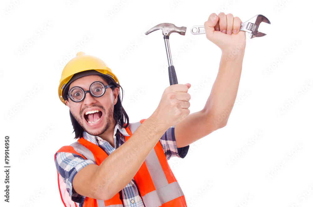 Funny young construction worker with hammer and wrench isolated Funny young construction worker with hammer and wrench isolated