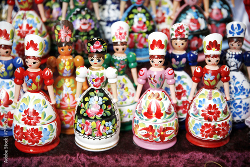 Wooden dolls in hungarian folk costumes as souvenir in row