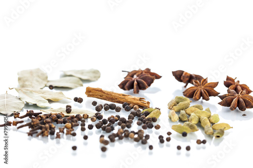 Assorted exotic spices on white background